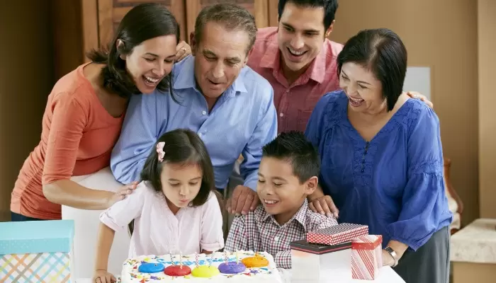 multi generation family celebrating birthday